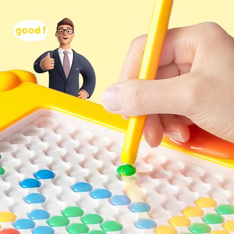 Overhead view of a magnetic drawing board showing a child's doodle, educational and engaging toy.