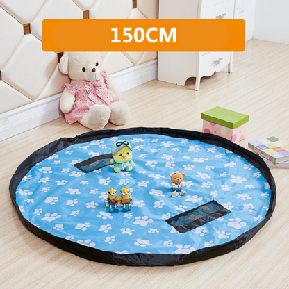 Child happily playing with toys on a large 2-in-1 play mat which doubles as toy storage bag