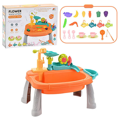 Toddler girl washing dishes and fishing in her 2-in-1 play sink, creative role-play toy