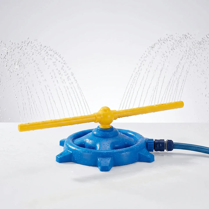 Children laughing and playing with a 360-degree rotating water sprinkler on a sunny lawn. Great outdoor summer fun.