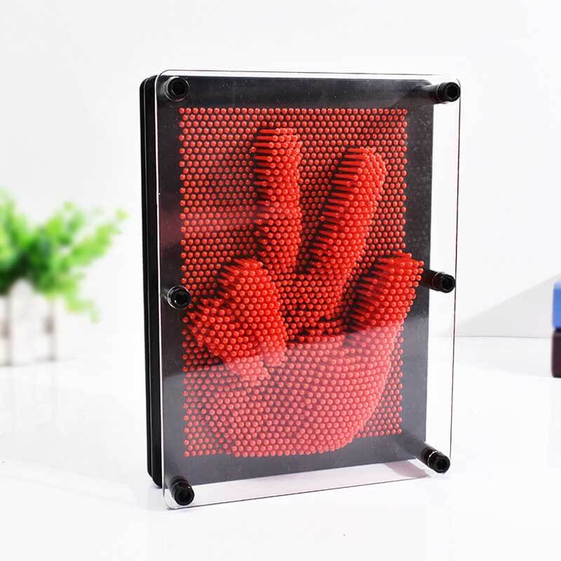 Different objects creating unique textures on a 3D Pin Art Board, ideal for sensory exploration.