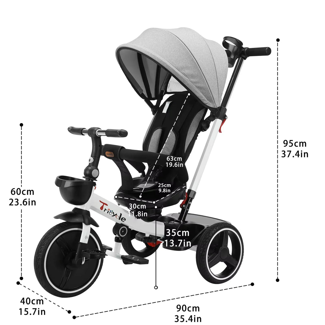 Toddler riding a black 6-in-1 Grow-with-Me Tricycle Stroller with parent push handle, outdoor play