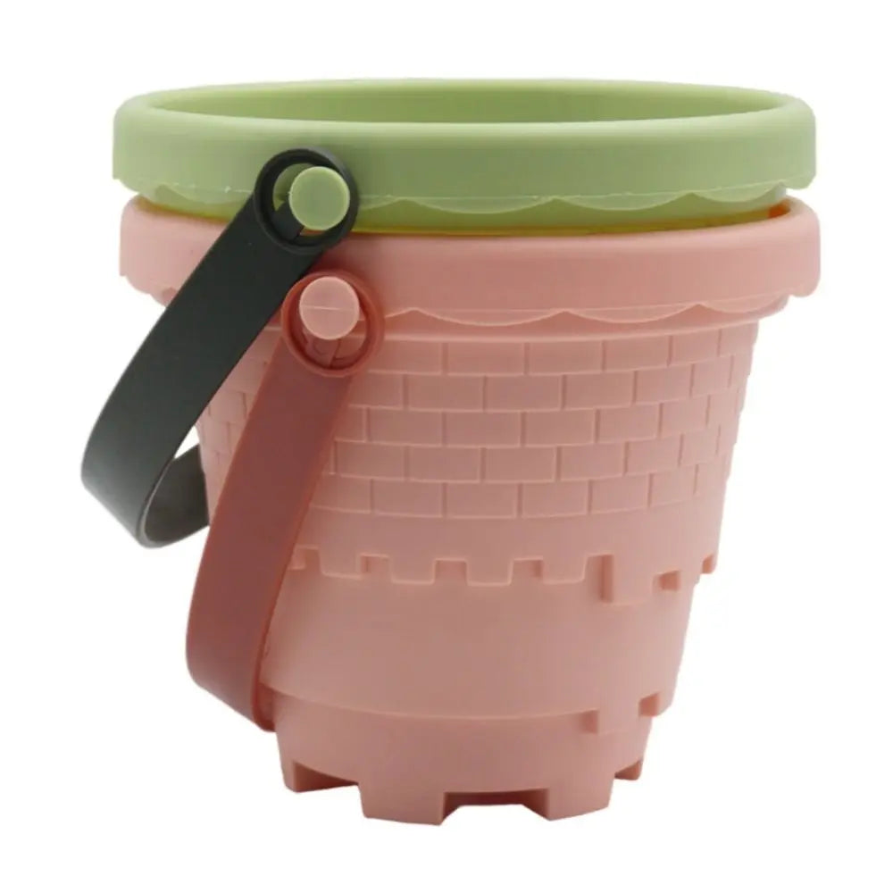 Close-up of animal-shaped sand molds from a durable kids' beach sand toy set, blue and green