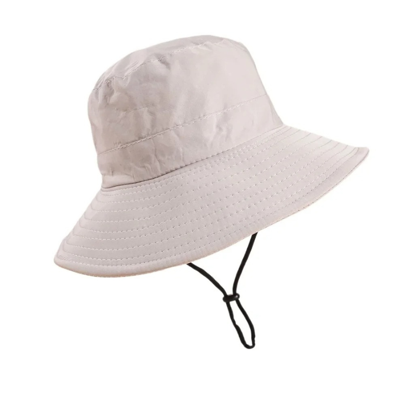 Close-up of a kids' beige adjustable sun hat, showcasing the durable fabric & UV protection, suitable for boys & girls