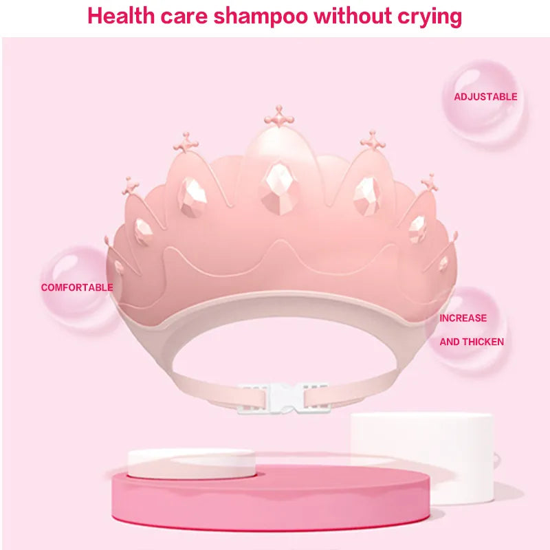 Front view of adjustable kids shower cap, blue with a prominent and playful cartoon crown design.