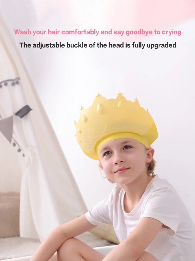 Collection of adjustable kids shower caps in various colors, all with a cute cartoon crown design.
