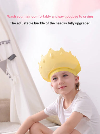 Collection of adjustable kids shower caps in various colors, all with a cute cartoon crown design.