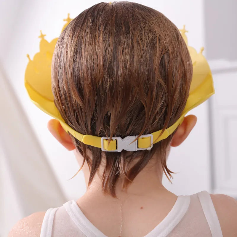 Toddler shower cap, blue adjustable with a fun cartoon crown design, ensuring a tear-free bath.