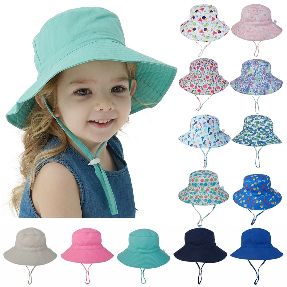Kids' adjustable sun hat with wide brim, UV protection, and playful whale design for toddlers