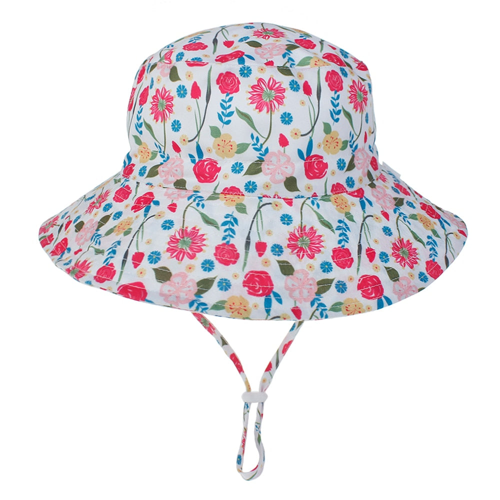 Breathable kids' sun hat with UPF 50+ UV protection, adjustable strap, in a cute shark pattern