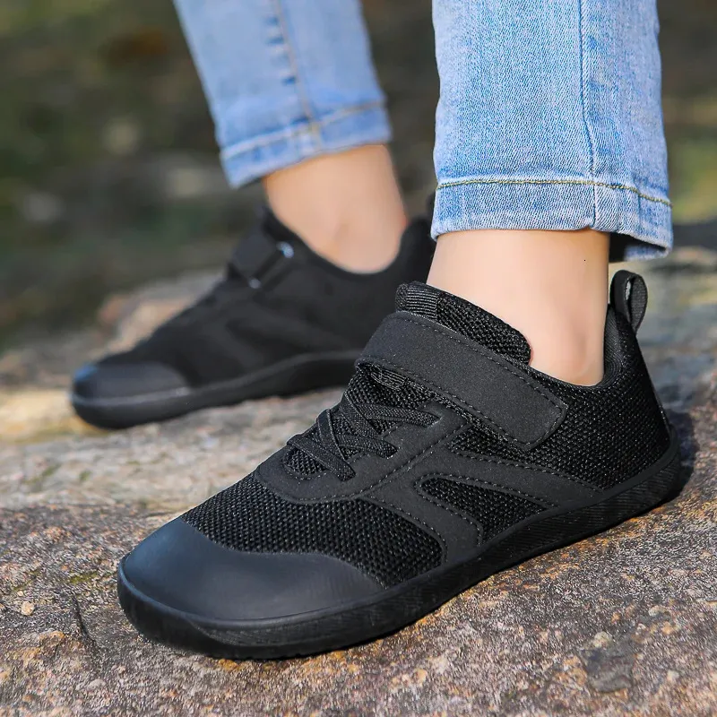 Front view of children's non-slip barefoot sneakers with easy-close velcro straps