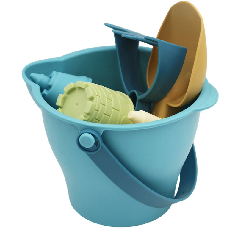 Children's sensory play beach sand toy set with a yellow bucket, watering can, and sea creature molds.