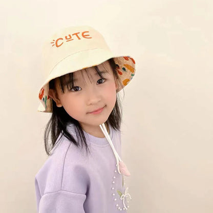 Kids beige reversible bucket hat, cotton, for sun protection. Perfect for toddlers and children.