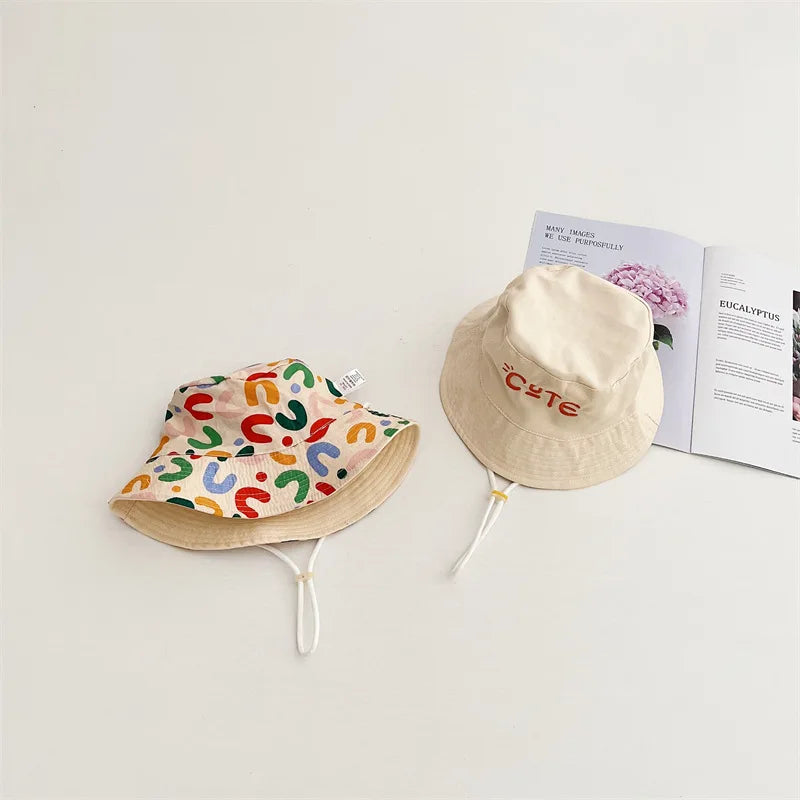 Unisex kids beige cotton bucket hat, reversible for versatile wear and outdoor play.