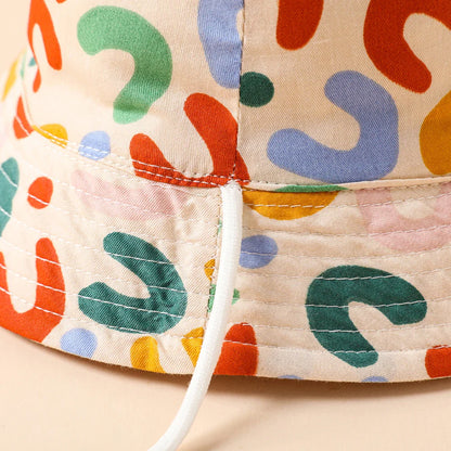 Toddler's reversible beige sun protection hat, essential children's fashion outdoor gear.