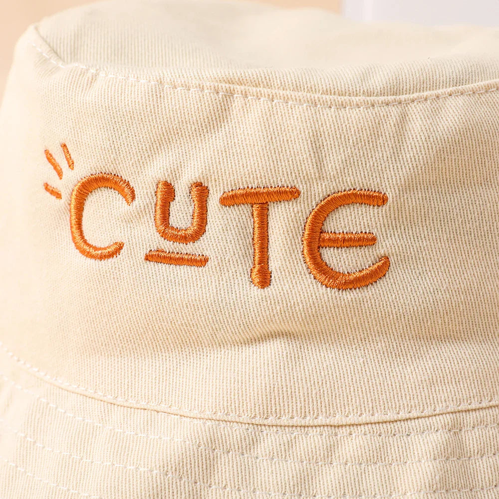 Beige kids bucket hat offering double-sided wear and excellent sun protection for summer.