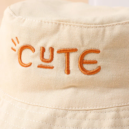 Beige kids bucket hat offering double-sided wear and excellent sun protection for summer.