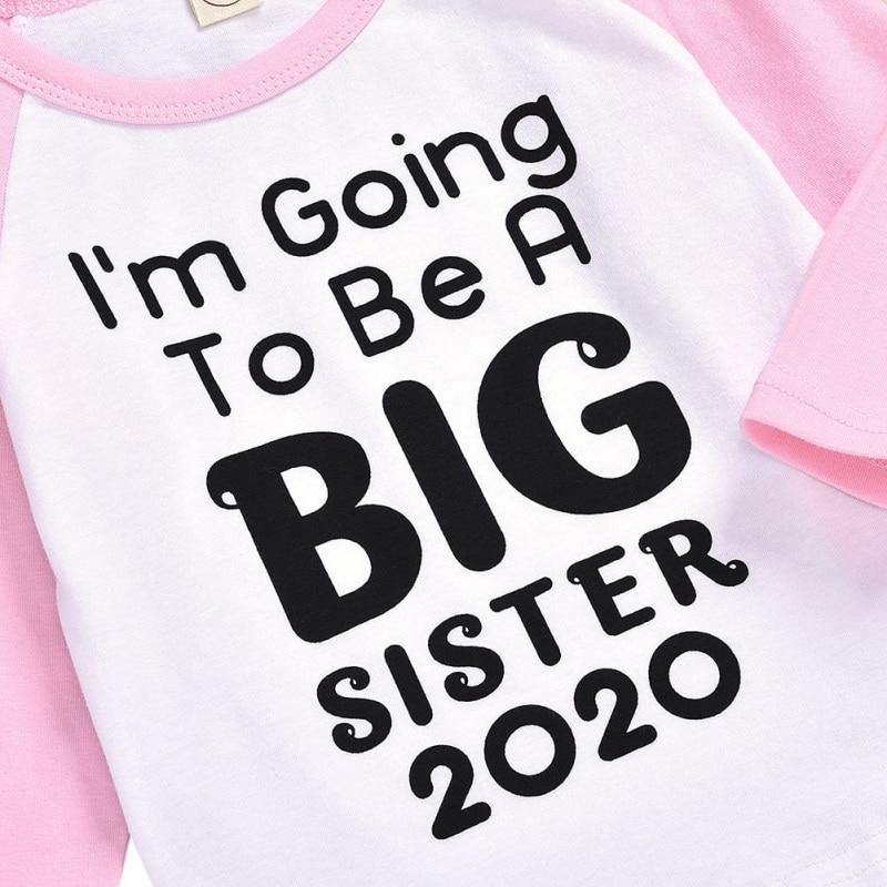 White kids t-shirt featuring 'Big Sister' print, a cute and simple baby announcement gift.