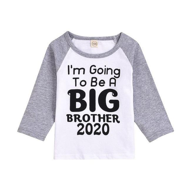 Close-up of a 'Big Sister' t-shirt graphic, detailing the joyful pregnancy announcement design.