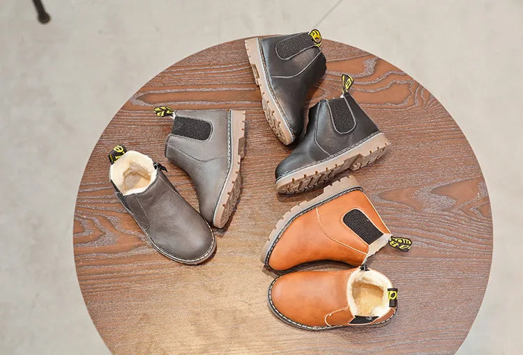 Comfortable children's winter boots, stylish black leather with a dependable zipper for cold weather