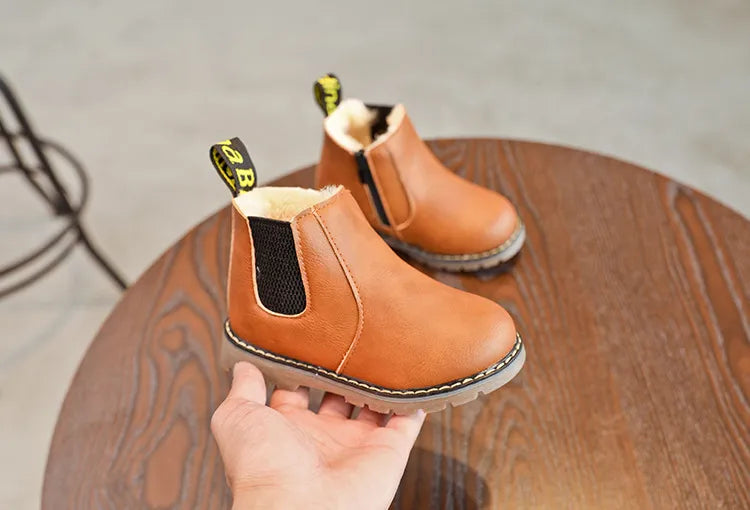 Zippered kids' fashion boots, black leather, excellent for keeping little feet warm and dry in snow