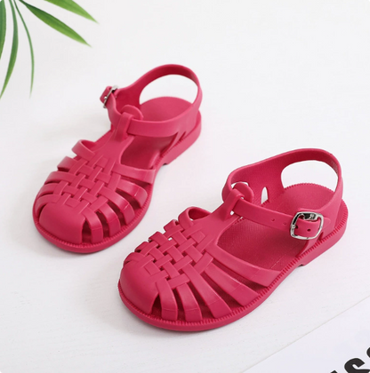 Cutout of anti-slip children's swim shoes, showing textured sole for water safety