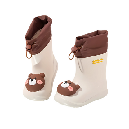 Close-up of a green bear character rain boot, showing waterproof material and sole