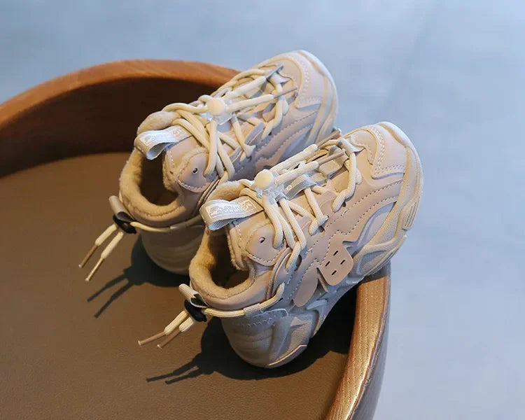 Bottom of a child's waterproof sports sneaker, showing anti-slip sole tread for maximum grip