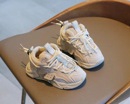 Detail of the elastic closure system on a kid's plush waterproof sports shoe for easy wear