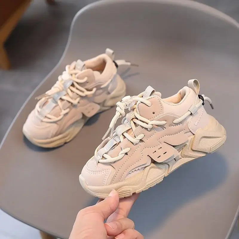 Side view of children's waterproof athletic shoes, showcasing elastic closure & anti-slip sole for safety