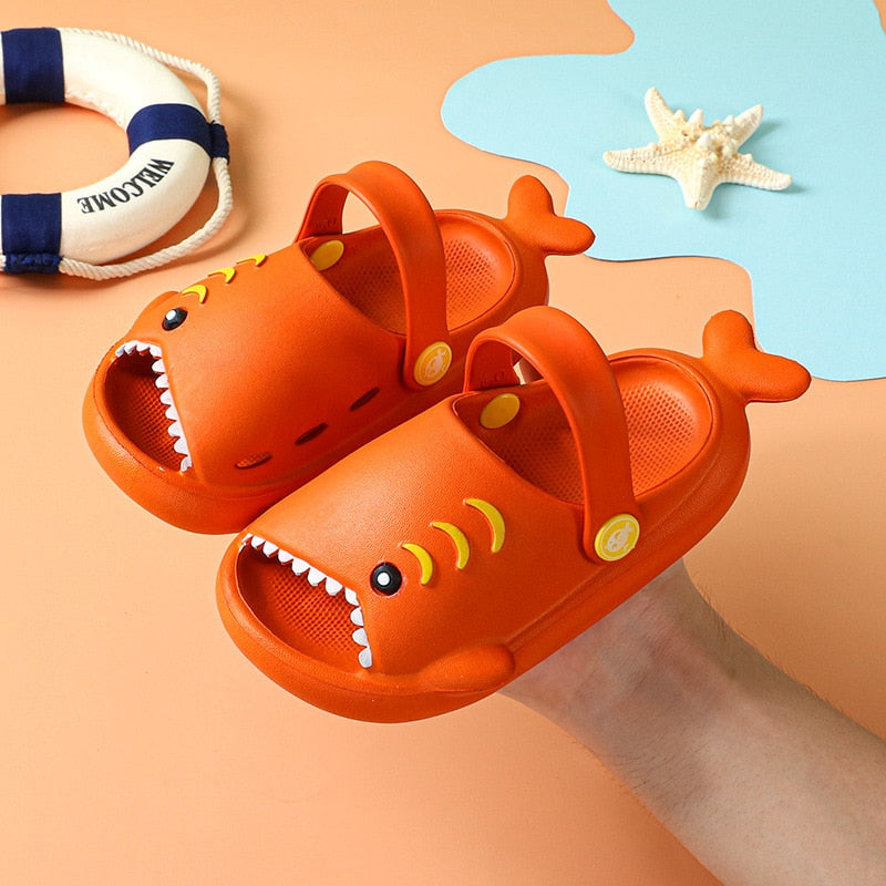 Close-up of a blue shark slide sandal, showcasing fin detail, comfortable EVA for kids