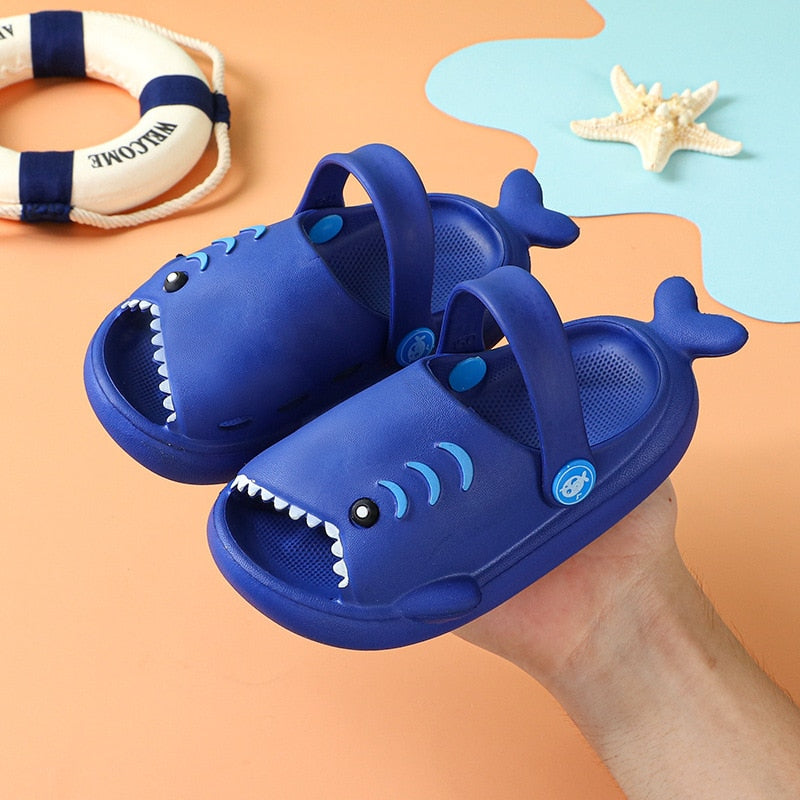 Pair of fun blue shark slides, perfect non-slip summer sandals for young boys and girls
