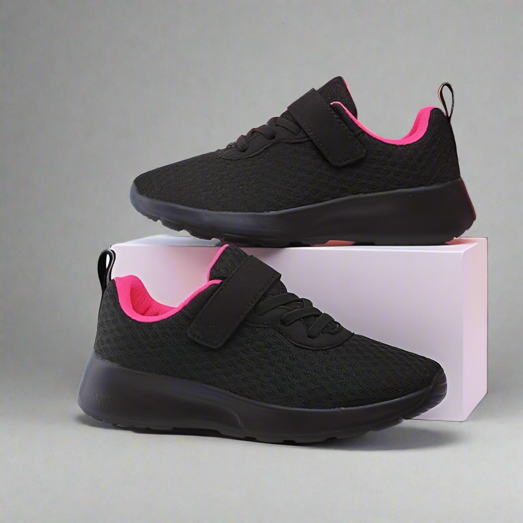 Close-up of the breathable mesh upper on kids' running shoes, highlighting ventilation and activewear comfort.
