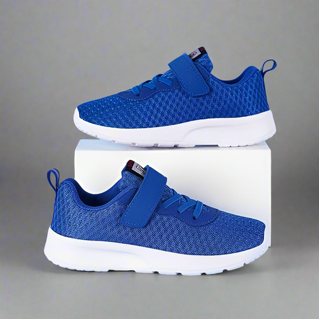 Side view of kids' athletic mesh sneakers, showcasing durable outsole and supportive design for outdoor play.