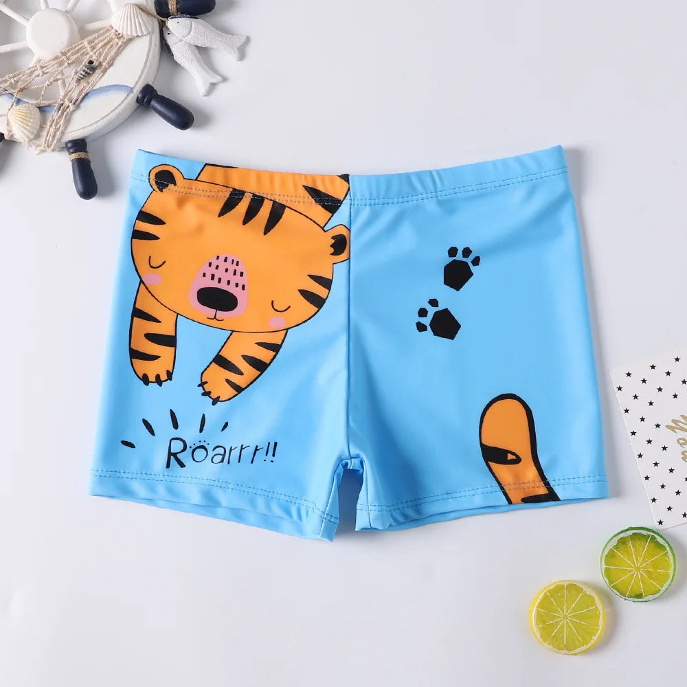 Kids' quick-dry blue swim trunks with fun cartoon sea creatures, ideal for active boys