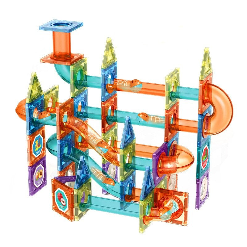 Kids building a magnetic marble track, showcasing colorful pieces and STEM learning.
