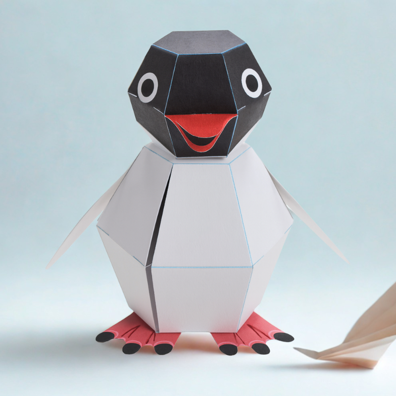 Kids building a pop-up penguin craft kit, creating a fun paper automata toy for creative play.