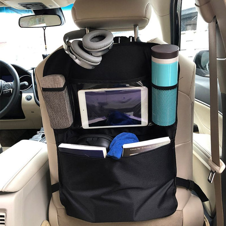 Kids' car seat back organizer, multi-pocket storage for toys & snacks, protecting car seats on road trips.
