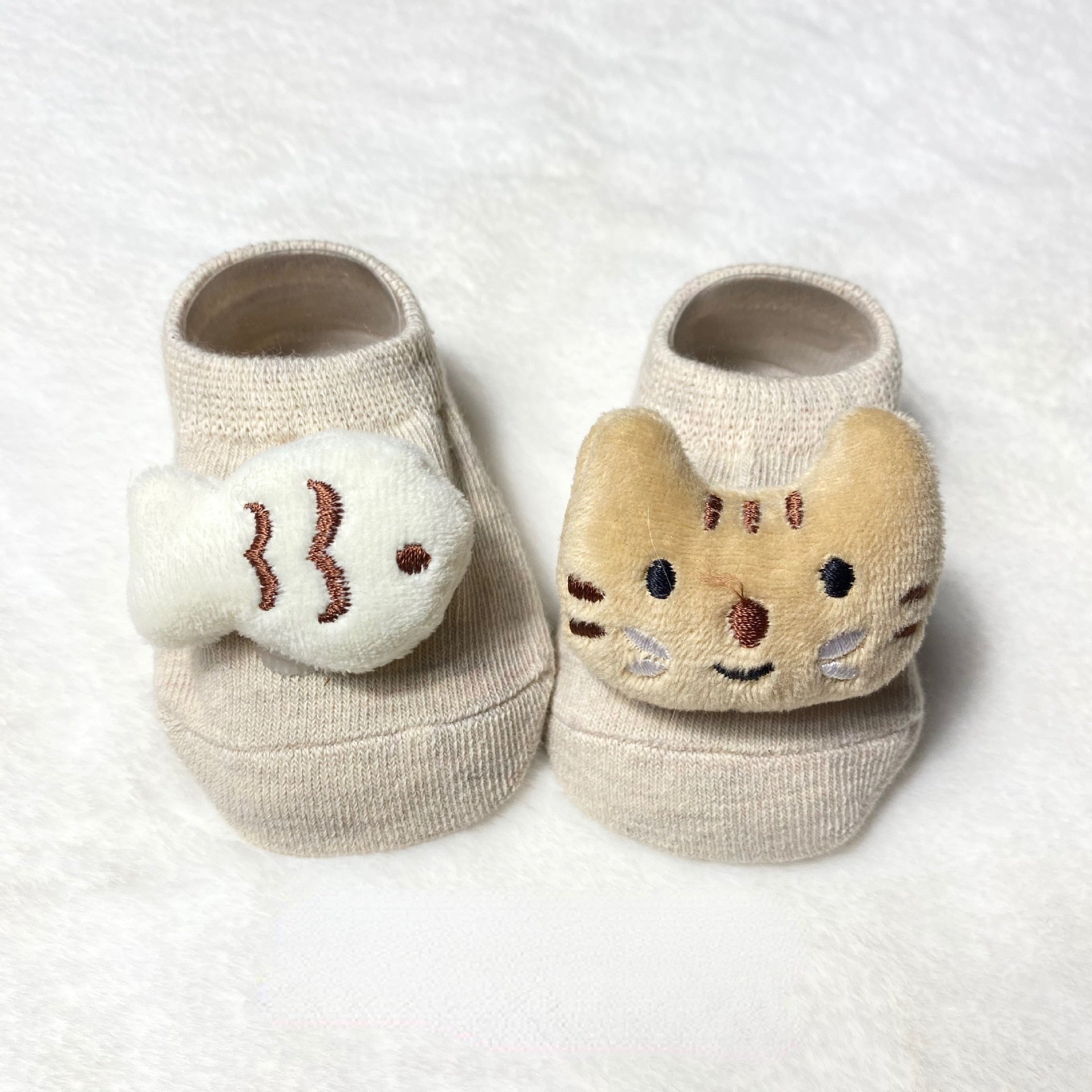 Assortment of vibrant animal doll concept toddler socks, ideal for active children