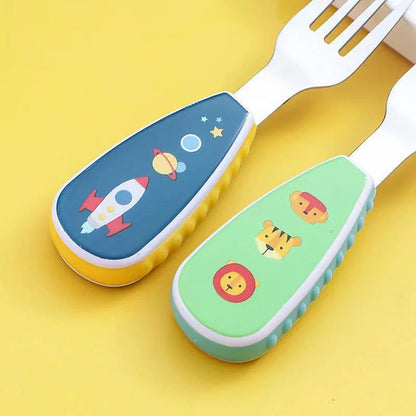 Close-up of a cartoon bear handle on a kids' stainless steel fork, encouraging self-feeding