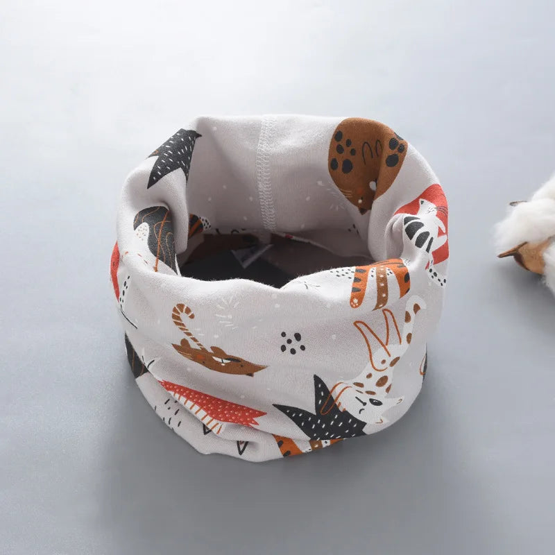 Baby's soft cartoon neck warmer, cream with cartoon sheep, a gentle accessory