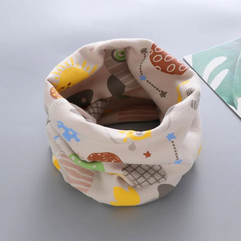 Toddler's stylish neck warmer, yellow with cartoon bees, adds flair to outfits
