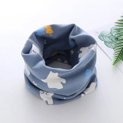 Baby's soft neck warmer, pink with cartoon flowers, offers gentle warmth and comfort