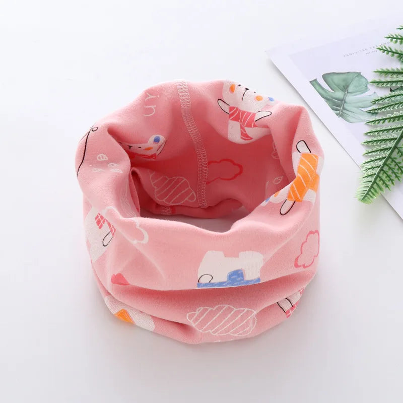 Child's cartoon neck muffler, red with a smiling bear, perfect for cold weather play