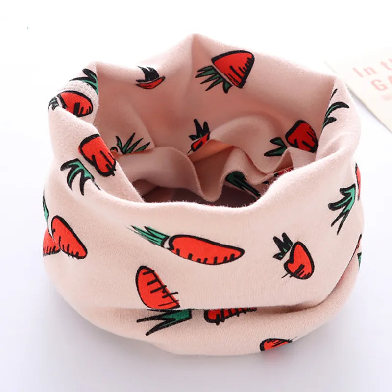 Winter kids neck tube with a vibrant cartoon train design, gentle on delicate skin