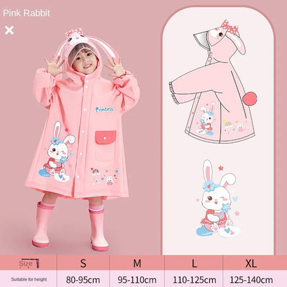 Girl in a pink cartoon raincoat with hood, holding the portable storage bag, active child