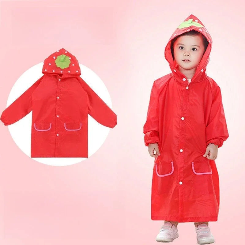 Group of kids wearing colorful cartoon waterproof rain ponchos with hoods, playing outdoors