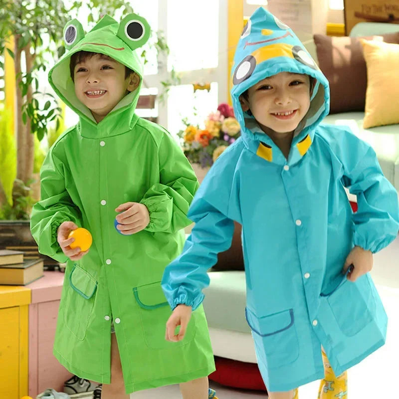 Green children's poncho, waterproof with hood and playful cartoon design, perfect for outdoor play