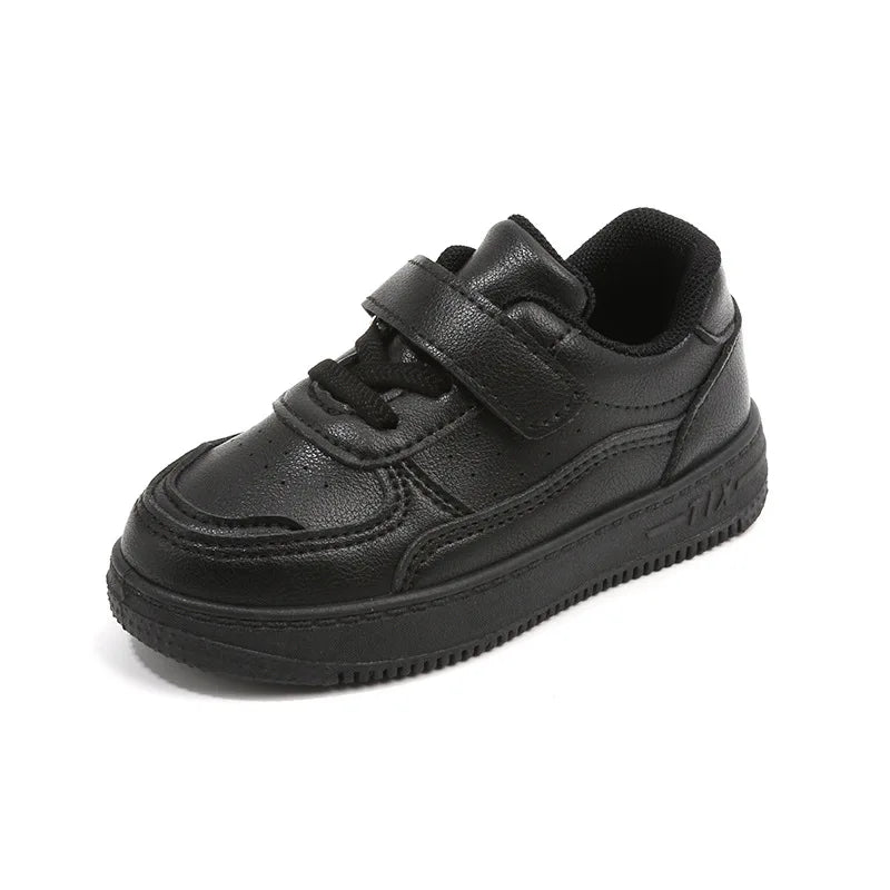 Close-up of kids casual sneakers showing breathable leather texture and secure velcro straps for autumn/spring