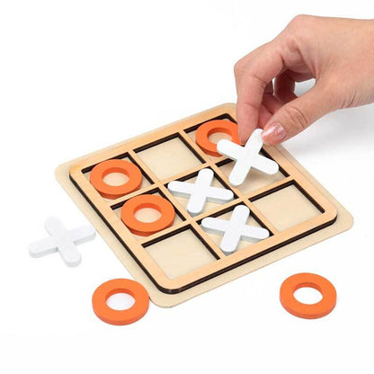 Wooden Tic Tac Toe travel game in a child's hands, highlighting the portable and educational aspects for kids.